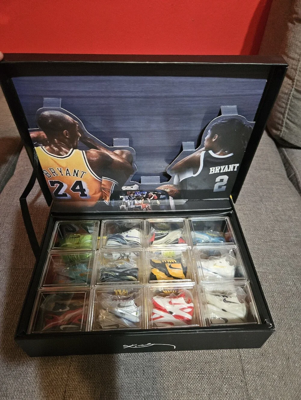 Kobe Black Mamba storage case with 12 mini sneakers included.
